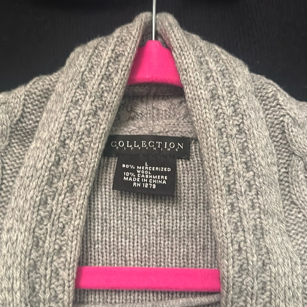 Well loved cardigan. Has stains on front and hole. Oops. Large wool.